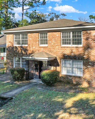 Ardsley Upscale Living exterior brick building with driveway